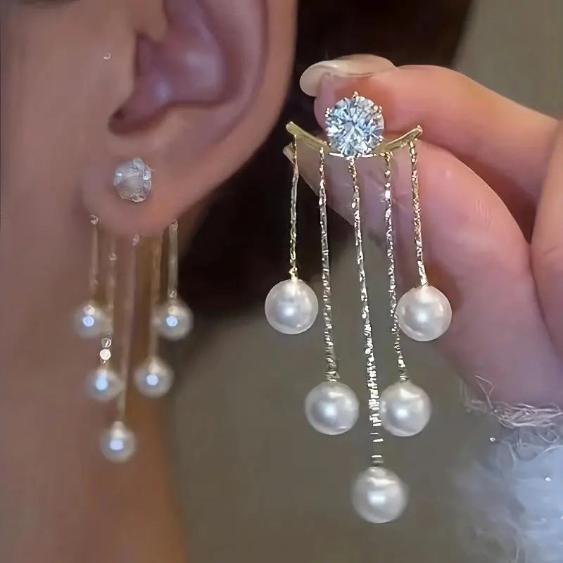Pearl Dangle Earrings — featuring a drop design accented with sparkling cubic zirconia.