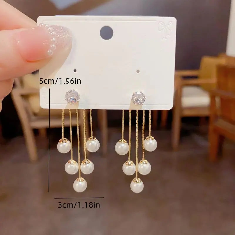 Pearl Dangle Earrings — featuring a drop design accented with sparkling cubic zirconia.
